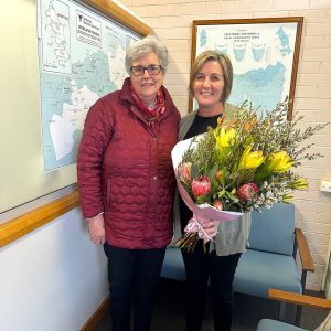 August 2024 - Di Arnold representing the Northbourne Residents Society delivering flowers to Mel Partridge as a thank you for our support.